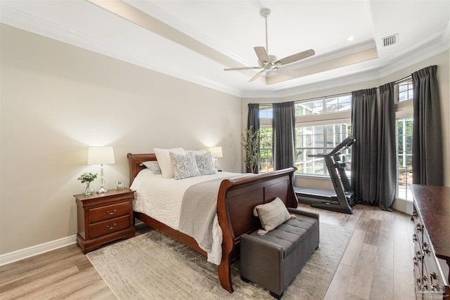 4282 Walden Way, Gulf Breeze, FL 32563 - bedroom featuring ornamental molding, light wood finished floors, a raised ceiling, baseboards, and ceiling fan