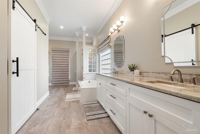 4282 Walden Way, Gulf Breeze, FL 32563 - bathroom with double vanity, a tub, crown molding, and recessed lighting