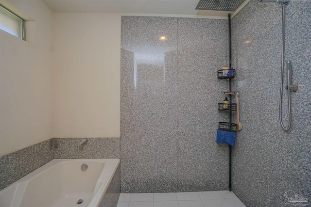 bathroom with independent shower and bath, tile walls, and tile patterned floors