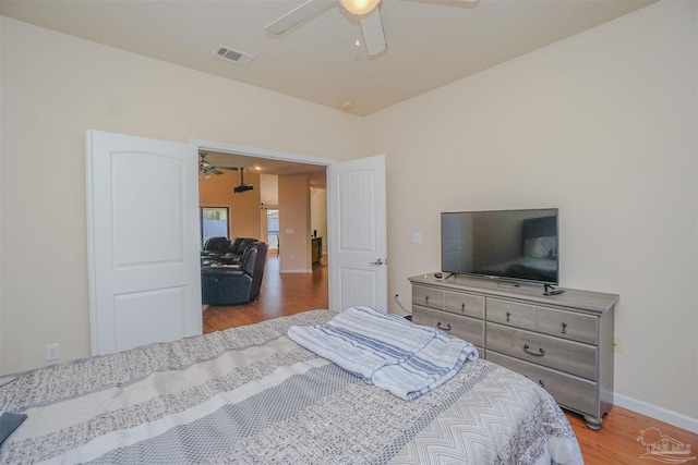 bedroom featuring light hardwood / wood-style floors and ceiling fan