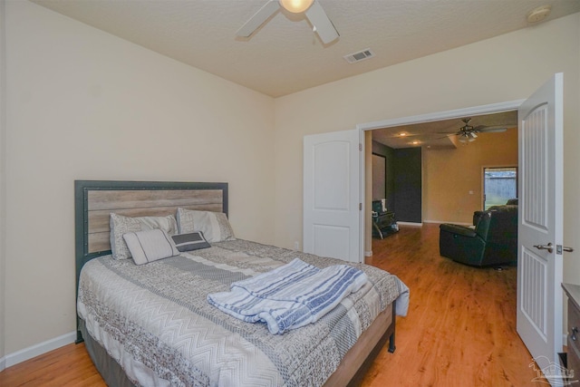 bedroom featuring ceiling fan and hardwood / wood-style flooring