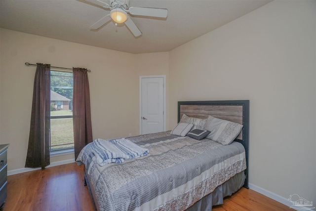 bedroom featuring hardwood / wood-style floors and ceiling fan