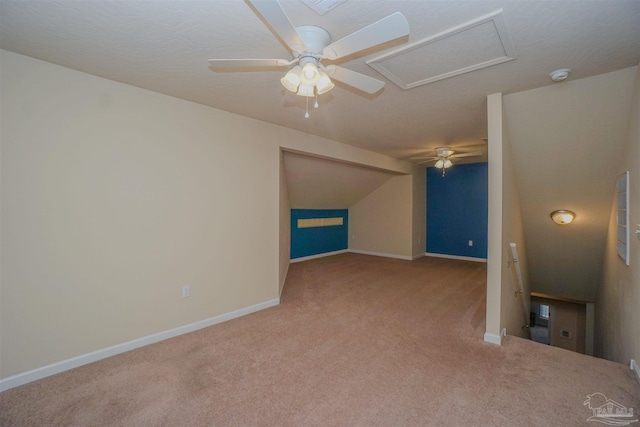 interior space with carpet flooring and ceiling fan