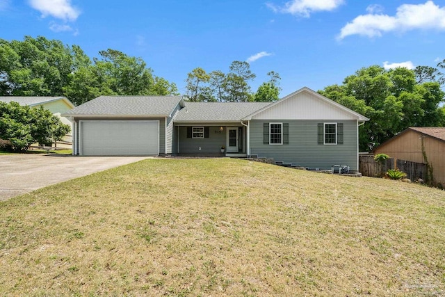 515 Juniper Ave, Niceville, FL 32578 - ranch-style home with fence, an attached garage, driveway, and a front yard