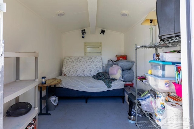 carpeted bedroom with lofted ceiling with beams