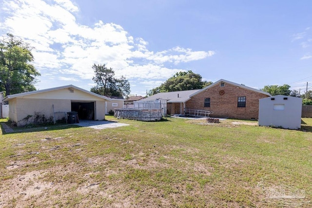 view of yard with a patio area and a storage unit