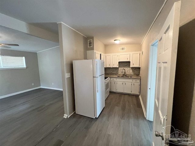 kitchen with dark wood-style floors, tasteful backsplash, white cabinetry, a sink, and white appliances