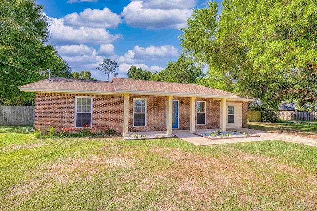 333 Western Pine Rd, Cantonment, FL 32533 - ranch-style house featuring brick siding, a front lawn, and fence