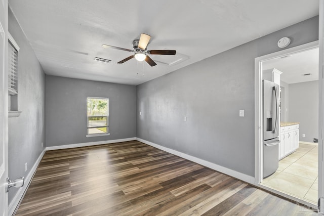 333 Western Pine Rd, Cantonment, FL 32533 - unfurnished bedroom featuring visible vents, a ceiling fan, light wood-style floors, baseboards, and stainless steel fridge