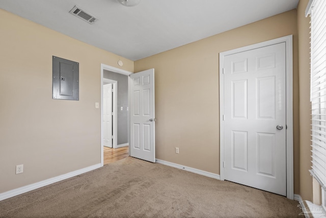 333 Western Pine Rd, Cantonment, FL 32533 - unfurnished bedroom featuring electric panel, baseboards, light carpet, and visible vents
