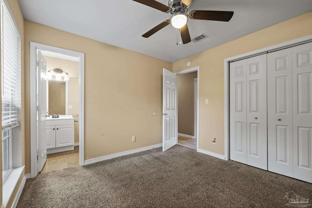 333 Western Pine Rd, Cantonment, FL 32533 - unfurnished bedroom featuring visible vents, connected bathroom, a closet, baseboards, and light colored carpet