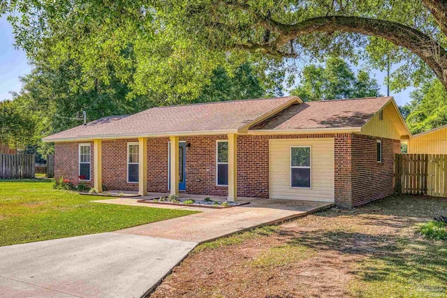 333 Western Pine Rd, Cantonment, FL 32533 - ranch-style home with brick siding, a front yard, and fence