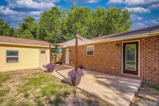 333 Western Pine Rd, Cantonment, FL 32533 - rear view of house with brick siding and a patio area