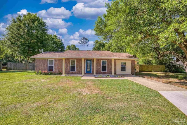 333 Western Pine Rd, Cantonment, FL 32533 - single story home with brick siding, a front lawn, and fence