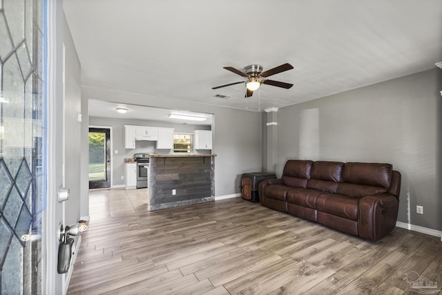 333 Western Pine Rd, Cantonment, FL 32533 - living area with light wood finished floors, a ceiling fan, baseboards, and visible vents