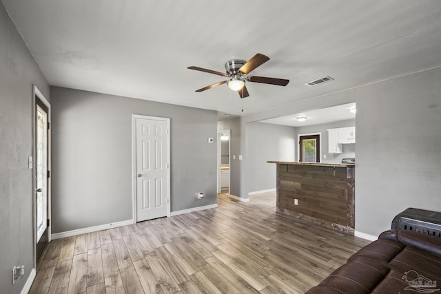 333 Western Pine Rd, Cantonment, FL 32533 - living room featuring visible vents, light wood finished floors, baseboards, and ceiling fan