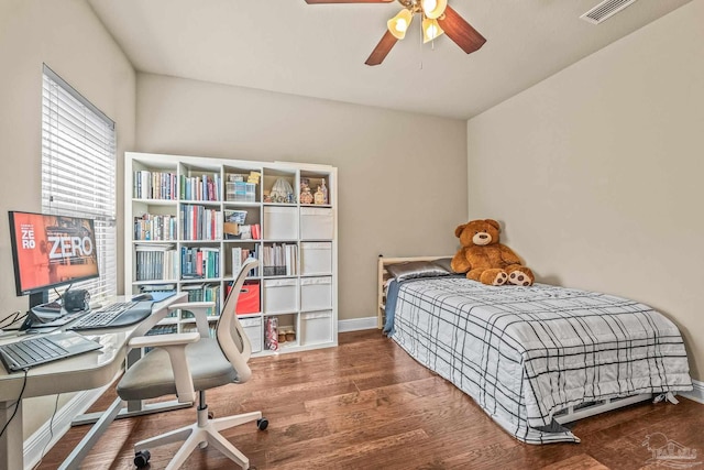 bedroom with ceiling fan and hardwood / wood-style floors