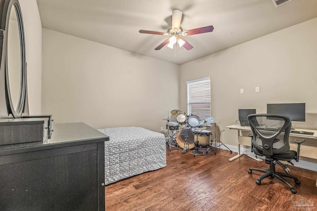 bedroom with wood-type flooring and ceiling fan