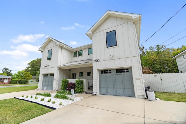 2550 N 11th Ave, Pensacola, FL 32503 - modern farmhouse with board and batten siding, a garage, driveway, and metal roof