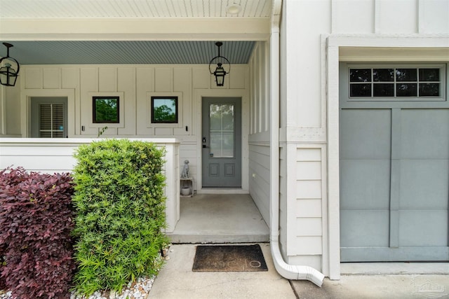 2550 N 11th Ave, Pensacola, FL 32503 - view of exterior entry with covered porch and board and batten siding