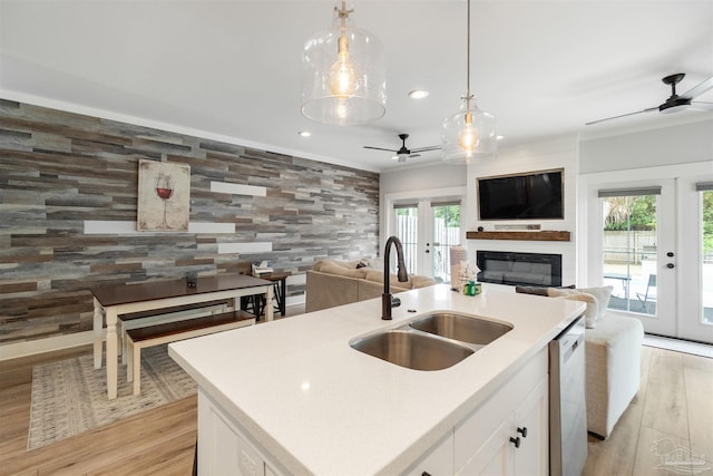 2550 N 11th Ave, Pensacola, FL 32503 - kitchen featuring a sink, french doors, a ceiling fan, open floor plan, and light wood-type flooring