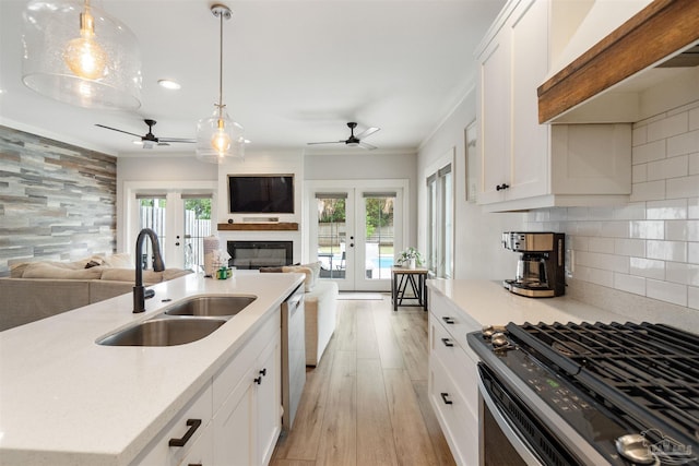 2550 N 11th Ave, Pensacola, FL 32503 - kitchen with french doors, a sink, ceiling fan, open floor plan, and ornamental molding