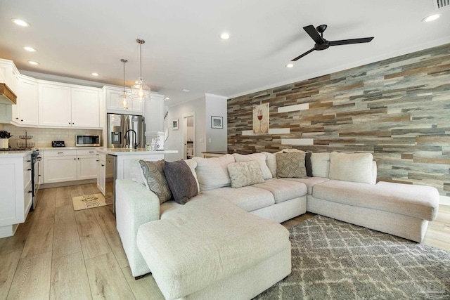 2550 N 11th Ave, Pensacola, FL 32503 - living area with recessed lighting, ceiling fan, light wood-style floors, and ornamental molding