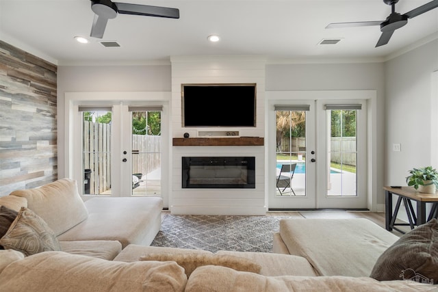 2550 N 11th Ave, Pensacola, FL 32503 - living room featuring french doors, a ceiling fan, crown molding, recessed lighting, and wood finished floors