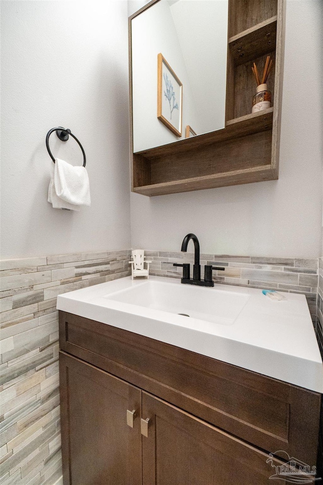 2550 N 11th Ave, Pensacola, FL 32503 - bathroom featuring vanity, tile walls, and a wainscoted wall