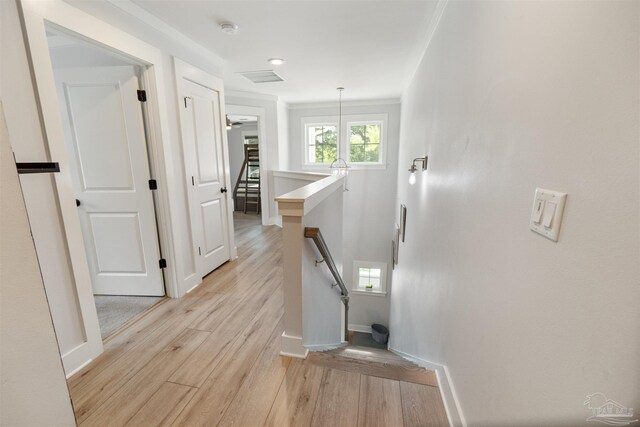 2550 N 11th Ave, Pensacola, FL 32503 - hall with an upstairs landing, light wood-style flooring, and baseboards
