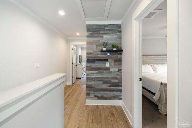 2550 N 11th Ave, Pensacola, FL 32503 - hallway with an accent wall, recessed lighting, ornamental molding, light wood-style floors, and baseboards