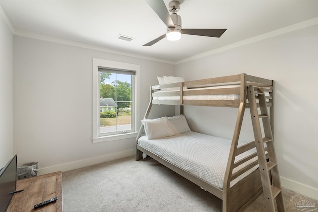 2550 N 11th Ave, Pensacola, FL 32503 - carpeted bedroom featuring baseboards, crown molding, and a ceiling fan