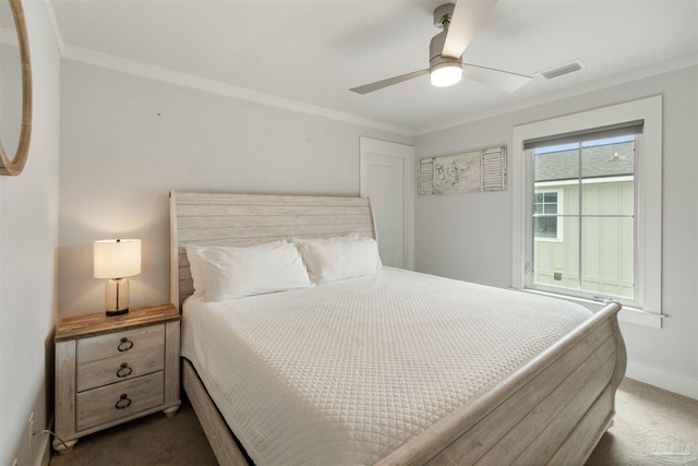2550 N 11th Ave, Pensacola, FL 32503 - bedroom with dark colored carpet, baseboards, ceiling fan, and ornamental molding