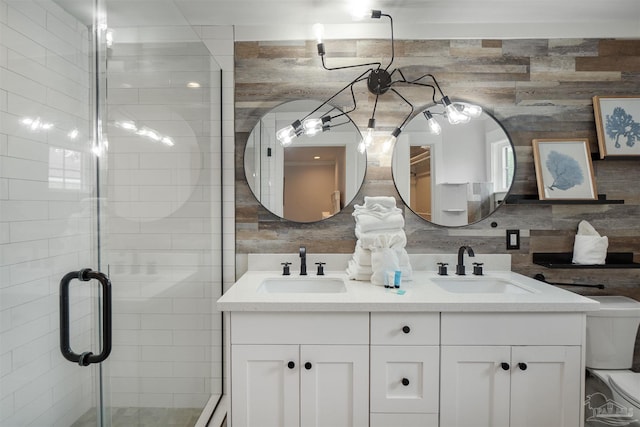2550 N 11th Ave, Pensacola, FL 32503 - bathroom featuring double vanity, a stall shower, toilet, and decorative backsplash