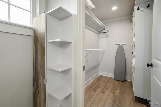 2550 N 11th Ave, Pensacola, FL 32503 - walk in closet with light wood-style flooring