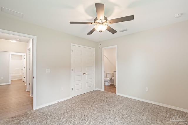 7929 Huntington Creek Ln, Pensacola, FL 32526 - unfurnished bedroom featuring baseboards, carpet, ensuite bathroom, and a ceiling fan