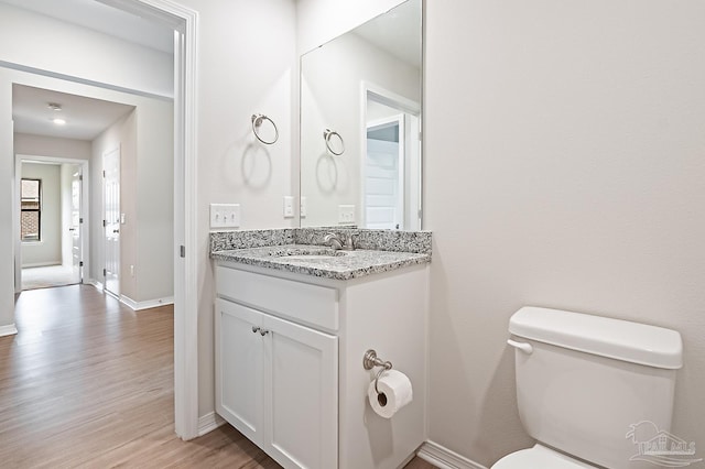 7929 Huntington Creek Ln, Pensacola, FL 32526 - bathroom featuring wood finished floors, vanity, toilet, and baseboards