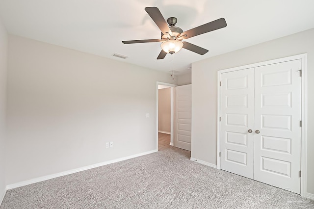 7929 Huntington Creek Ln, Pensacola, FL 32526 - unfurnished bedroom featuring light carpet, a closet, baseboards, and a ceiling fan