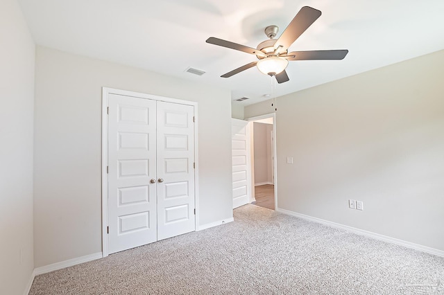 7929 Huntington Creek Ln, Pensacola, FL 32526 - unfurnished bedroom featuring carpet, a closet, baseboards, and ceiling fan
