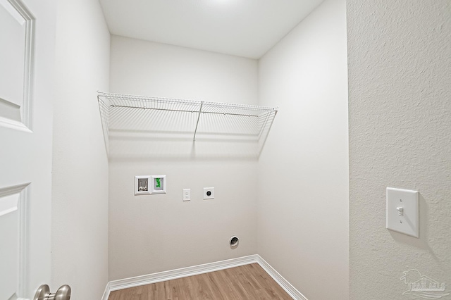 7929 Huntington Creek Ln, Pensacola, FL 32526 - laundry room featuring hookup for an electric dryer, washer hookup, wood finished floors, and baseboards