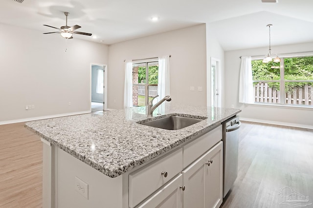 7929 Huntington Creek Ln, Pensacola, FL 32526 - kitchen featuring a sink, light wood-style floors, an island with sink, hanging light fixtures, and a ceiling fan