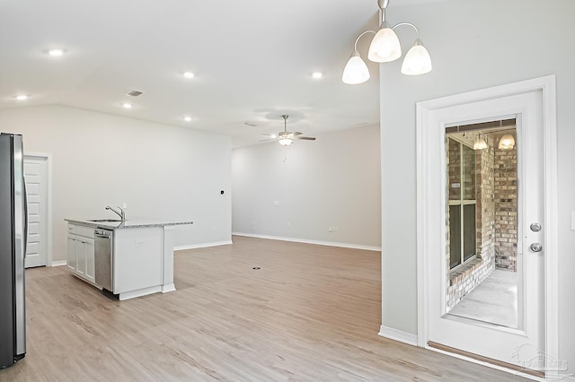 7929 Huntington Creek Ln, Pensacola, FL 32526 - kitchen featuring ceiling fan, light wood finished floors, stainless steel appliances, pendant lighting, and baseboards