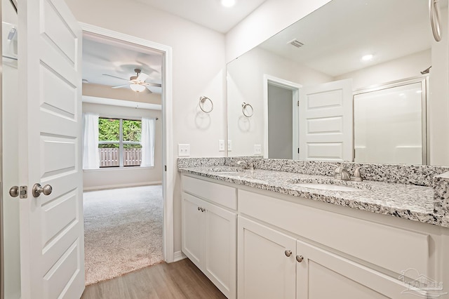 7929 Huntington Creek Ln, Pensacola, FL 32526 - full bathroom featuring wood finished floors, a ceiling fan, double vanity, and baseboards