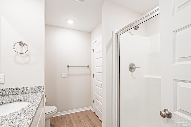 7929 Huntington Creek Ln, Pensacola, FL 32526 - full bathroom featuring a stall shower, wood finished floors, baseboards, toilet, and recessed lighting