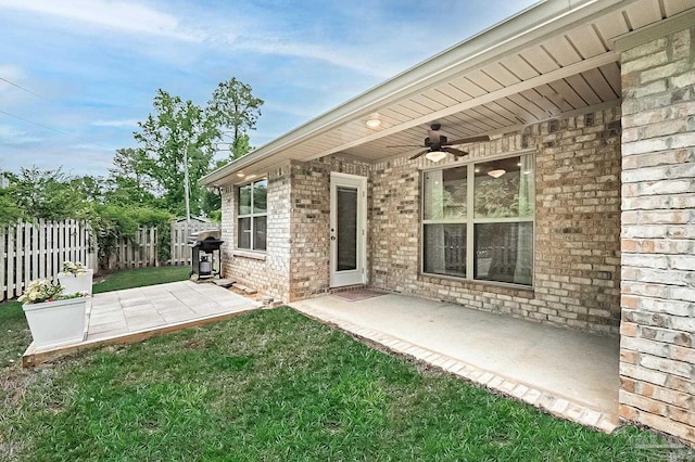 7929 Huntington Creek Ln, Pensacola, FL 32526 - back of property featuring a ceiling fan, brick siding, and a patio