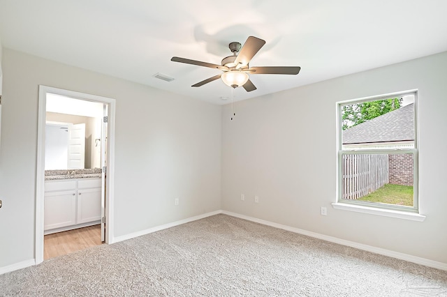 7929 Huntington Creek Ln, Pensacola, FL 32526 - unfurnished bedroom with light colored carpet, baseboards, and ensuite bathroom