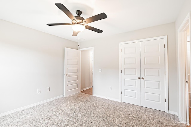 7929 Huntington Creek Ln, Pensacola, FL 32526 - unfurnished bedroom featuring carpet, a closet, baseboards, and ceiling fan