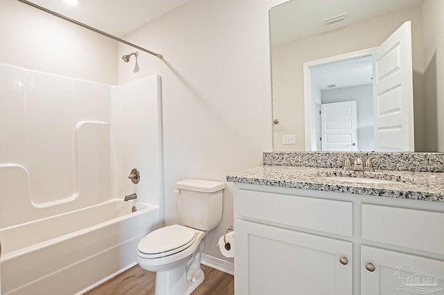 7929 Huntington Creek Ln, Pensacola, FL 32526 - bathroom with wood finished floors, toilet, bathing tub / shower combination, vanity, and baseboards