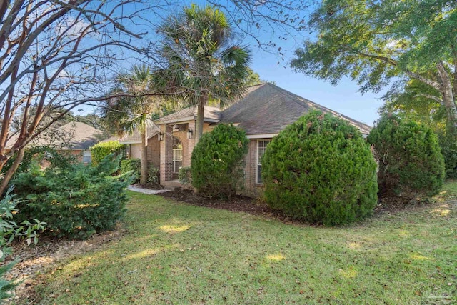 view of property exterior with a lawn