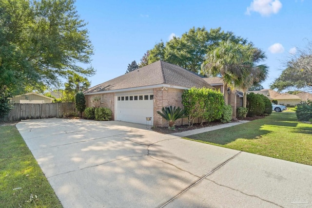 view of property exterior featuring a garage and a lawn